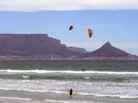 Kite Surfing at Bloubergstrand with Table Mountain and Lion's Head as backdrop